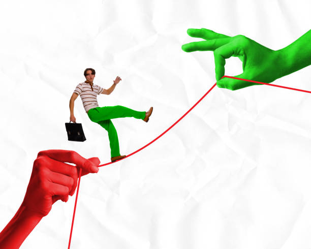 istock Poster. Contemporary art collage. Young man with bag for document balancing on red drawn thread which holds hands against crumpled paper background. 1818406108