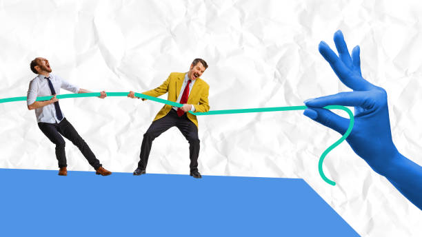 istock Poster. Contemporary art collage. against crumpled paper background. Two young man pulling rope against crumpled paper background. 1818406116