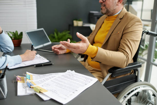 istock Businessman with disability talking to woman 1818414601
