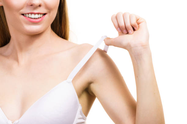istock Young woman holding bra strap 1818418472