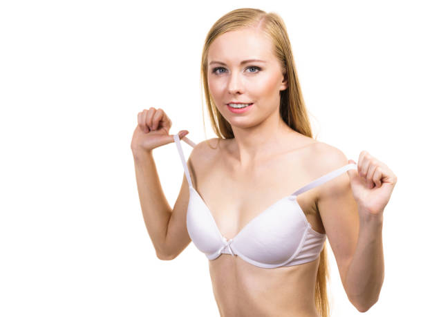 istock Young woman holding bra strap 1818419001