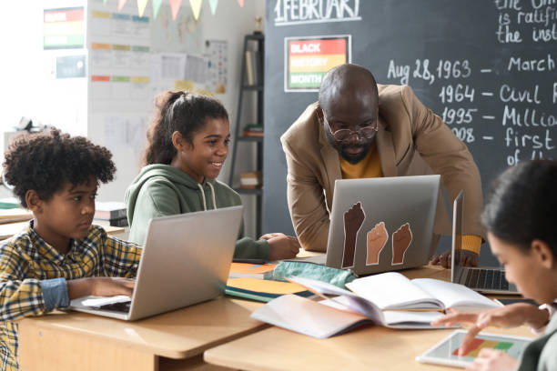 istock School children working with teacher in team 1818421452