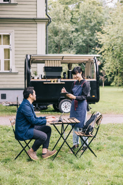 istock Small business coffee trailer owner taking order from a customer 1818422612