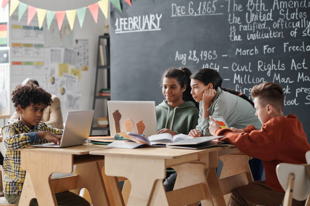 istock School children working in team during a lesson 1818422641