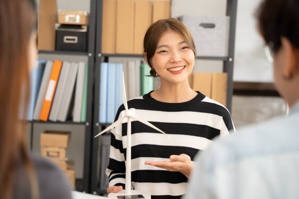 istock Asian beautiful talking with team in office. 1818434871