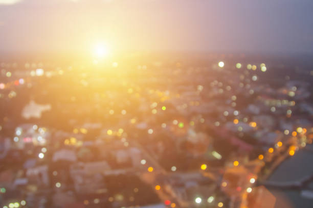 Abstract city lights blur blinking background. Soft focus horizontal long banner. Bokeh sparkles colorful defocused on dark texture for night party city. Abstract blurred pattern template.