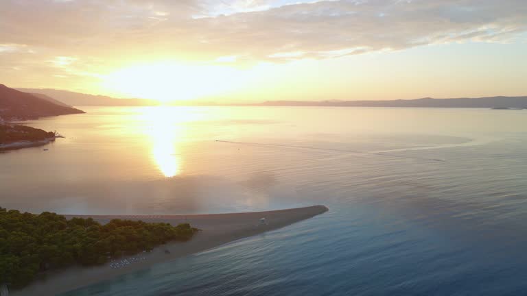 Zlatni Rat beach (Golden Horn beach) at sunset, Brac Island Croatia, aerial view