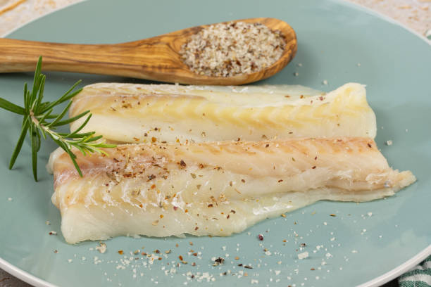 istock raw hake fillet, close-up, on a plate 1818468810