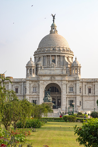 Kolkata,west bengal,India,13 april 2022  view of the famous victoria memorial with garden, a large marble building in central kolkata, at the time of sunrise.