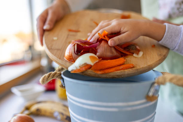 istock Mother and son reusing food waste in at home 1818480668