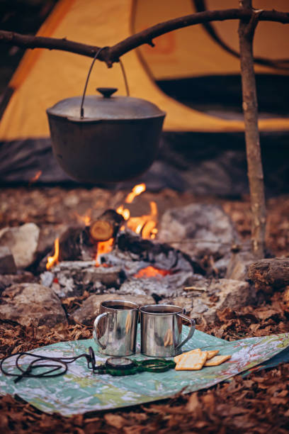 istock A pot on a fire against the background of a tent. 1818487616