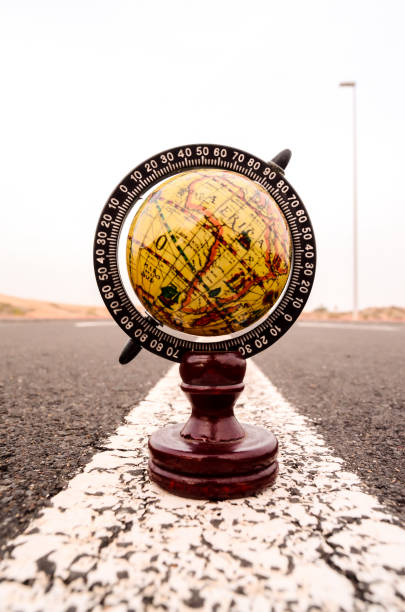 istock Globe Earth on an Asphalt Street 1818488645