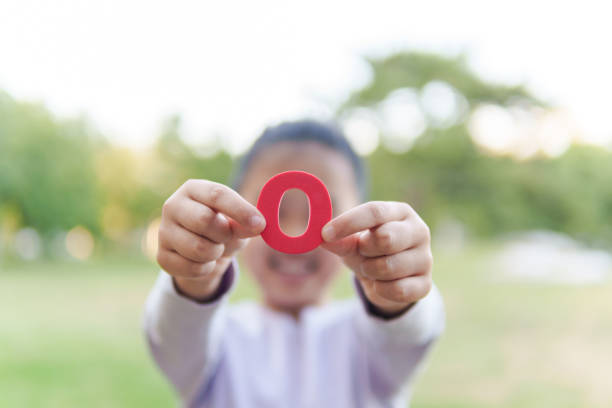 Child Holding Letter \