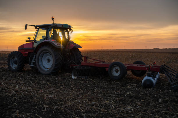 istock Farmer preparing his field in a tractor 1818489203