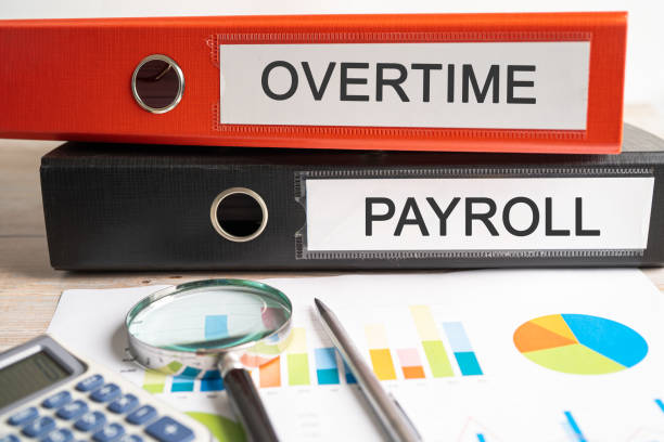 istock Overtime, Payroll. Binder data finance report business with graph analysis in office. 1818490653
