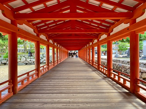 Japan - Miyajima Island near Hiroshima - Itsukushima Jinja ,Venerable 16th-century Shinto shrine with iconic orange gate that \