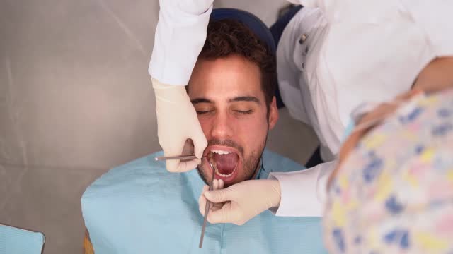 Dentist examining the dental health of a patient