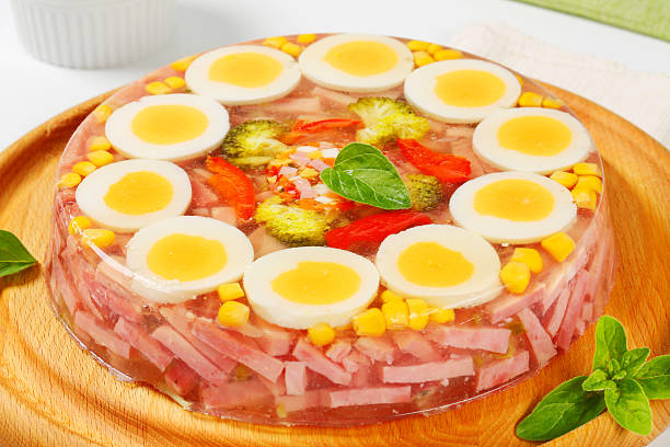 Savory aspic cake Ham strips and boiled egg in aspic jelly aspic stock pictures, royalty-free photos & images