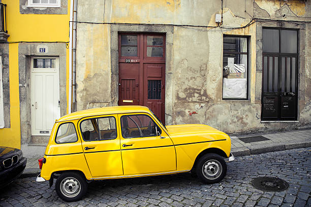 istock Typical old road in Oporto and a vintage car 181849759
