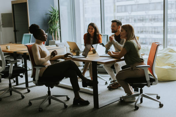 istock Young multiethnic startup team working in the modern office 1818503070