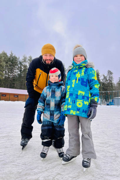 istock young caucasian bearded man skating with his sons 1818504153
