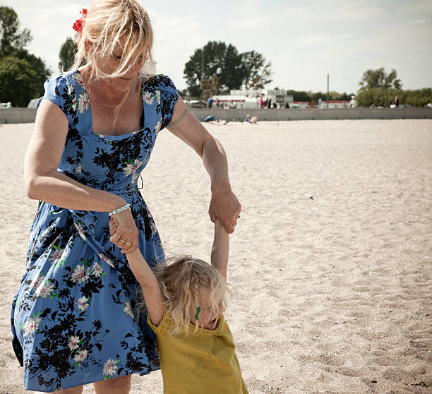 istock Woman & Child at the beach 181850453