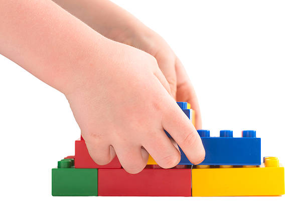 istock Child builds with colorful building blocks 181850528