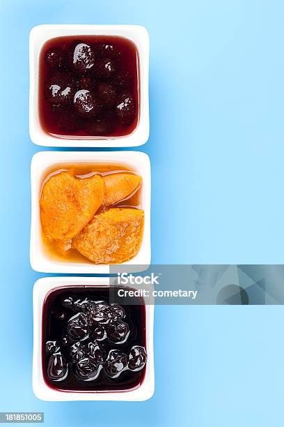 Three Jams Stock Photo - Download Image Now - Apricot Jam, Berry Fruit, Blue Background
