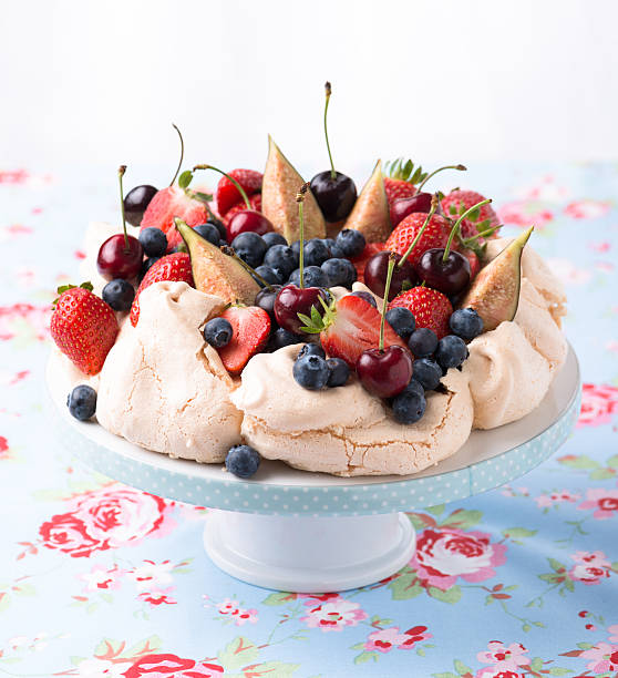 PAVLOVA meringue on a cake stand pavlova stock pictures, royalty-free photos & images
