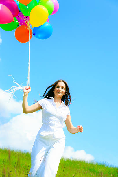istock woman with colorful balloons 181851040