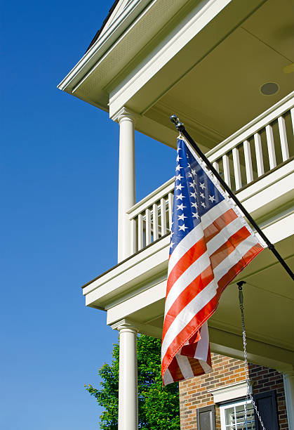 istock Front Porch with an American Flag 181851216
