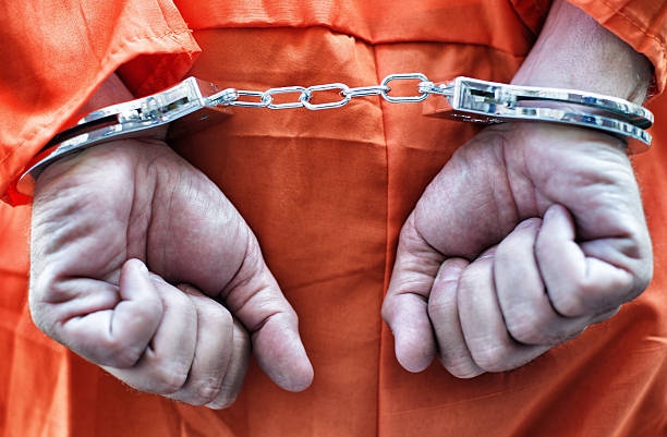 istock Close-Up of Prisoner hands 181851451