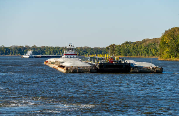 istock Tug boat pusher behind freight barges loaded with grain on Mississippi River 1818515635
