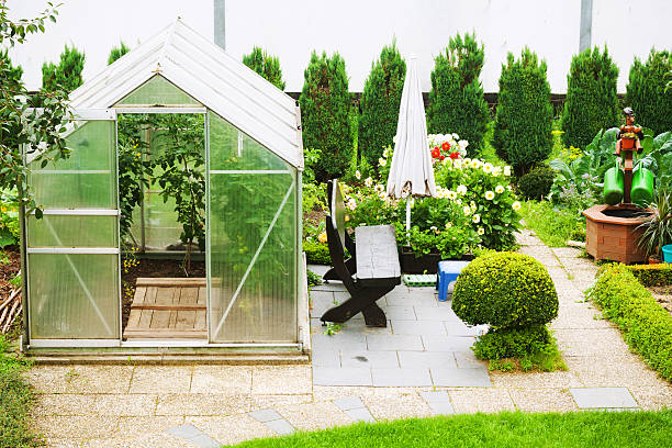 Garden with greenhouse in Germany.