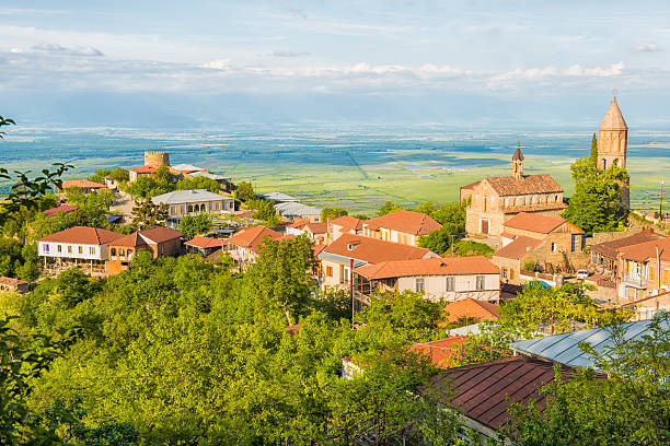 Sighnaghi "Sighnaghi is the most attractive town in Kakheti. the town was developed in the 18th century by King Erekle II, in part as a refuge for the areaaas populace against Lezgin and Persian attacks. The name Sighnaghi comes from the Turkish word for aEshelteraa, siinak. Each of the six entrances in Erekleaas 23 tower walls was named after a local village" kakheti georgia stock pictures, royalty-free photos & images