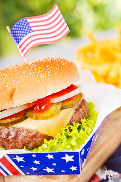 istock Burger with fries on an outdoor table in bright light 181853326
