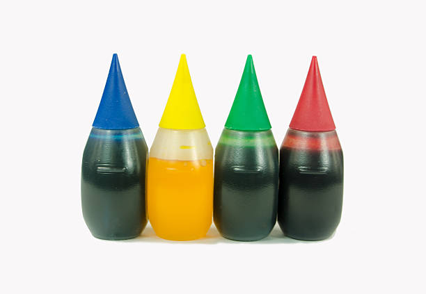 Food Coloring Bottles Three small food coloring plastic bottles on white. food coloring stock pictures, royalty-free photos & images