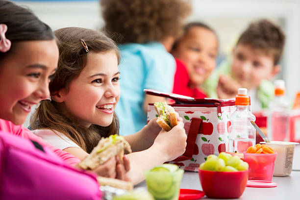 Healthy Lunch At School Group of children having packed lunches packed lunch photos stock pictures, royalty-free photos & images
