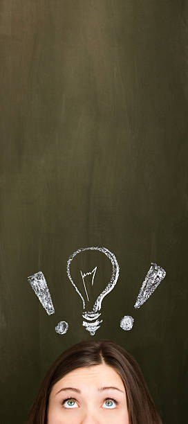 istock Young woman with light bulb / ideas 181853656