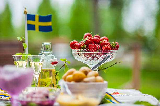 Smörgåsbord with pickled herring and snaps stock photo