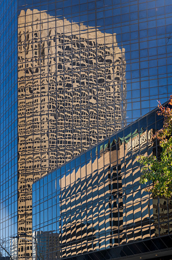 Complex reflections of a modern skyscrapers in St Louis office building