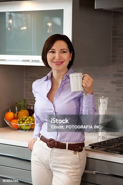 Young Woman In The Kitchen Stock Photo - Download Image Now - Adult, Adults Only, Angle