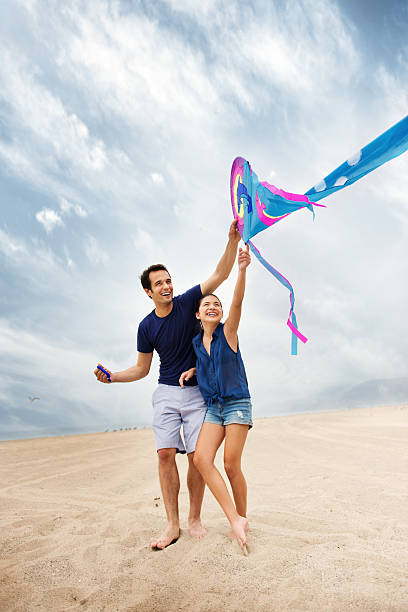 istock Father and daughter playing with a kite 181854769