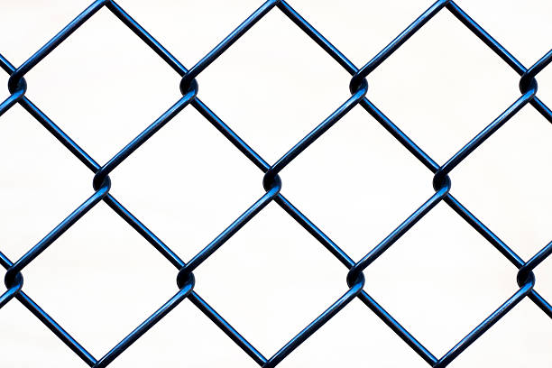 istock Closeup wire fence against white background, copy space 181854980