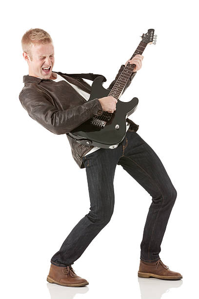 istock Young man playing a guitar with his eyes closed 181854995