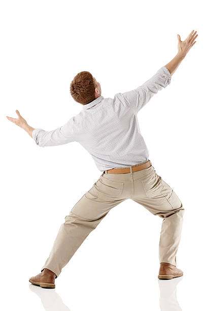 istock Young man looking away with his arms outstretched 181855347