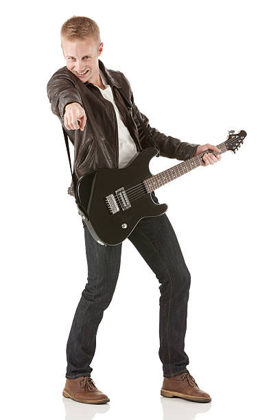 istock Young guitarist rocking out with a guitar 181855419