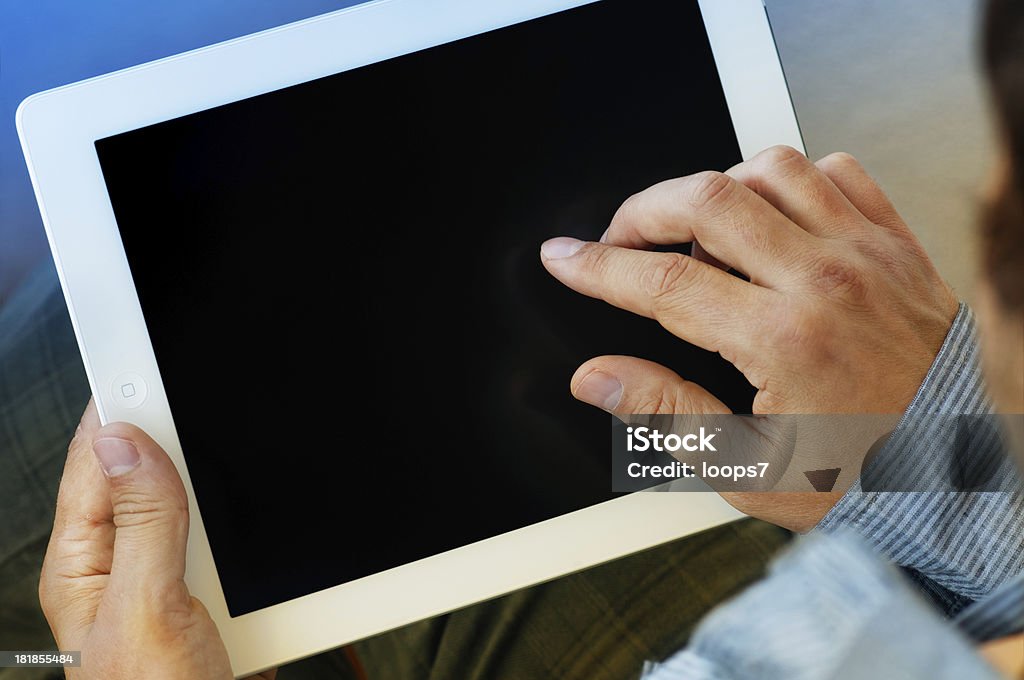 Tablet computer with blank screen Man holding a tablet computer with blank black screen Adult Stock Photo