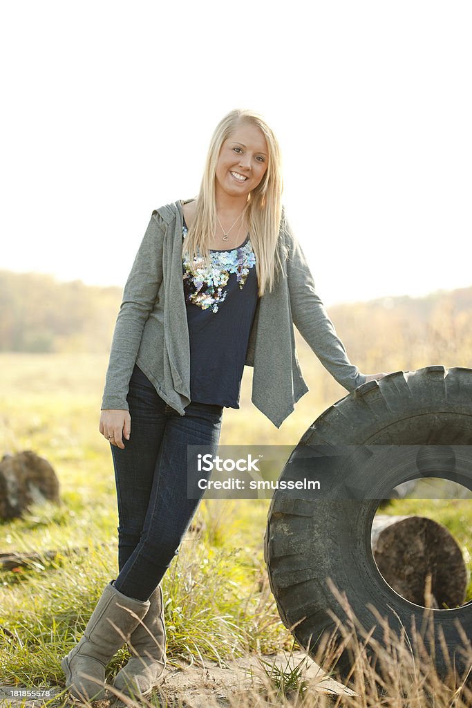 Pretty Young Blonde Girl Standing In A Field  18-19 Years Stock Photo