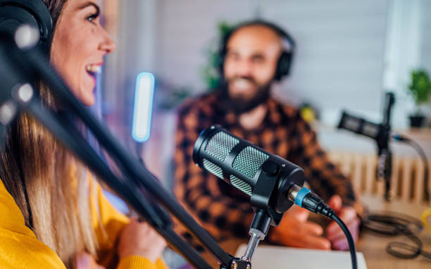 Two young people recording a podcast